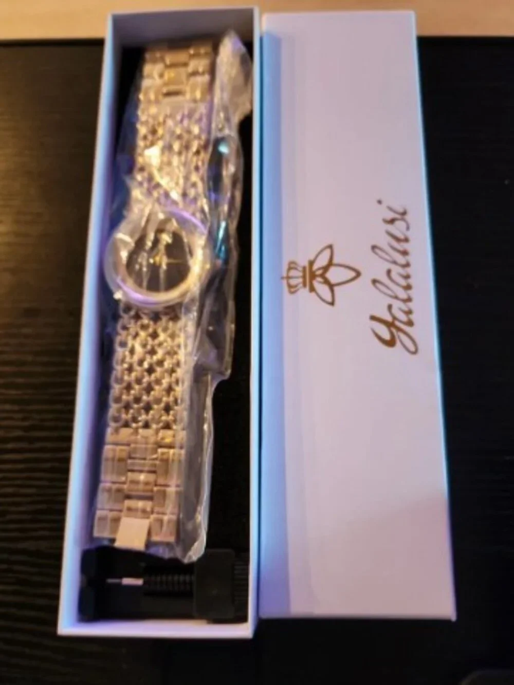 Elegant Gold-Tone Women's Dress Watch with Black Dial